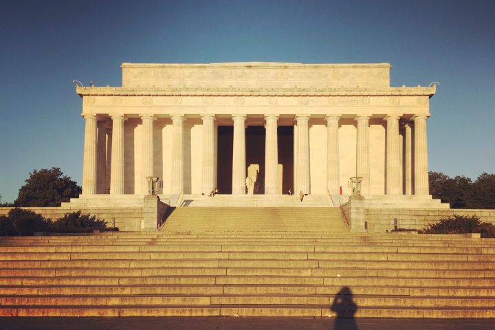 a person standing in front of Lincoln Memorial
