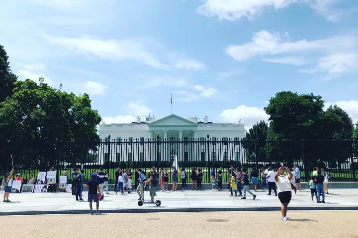 a group of people walking in a park