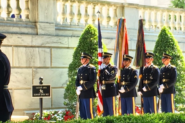 a group of people standing in front of a building