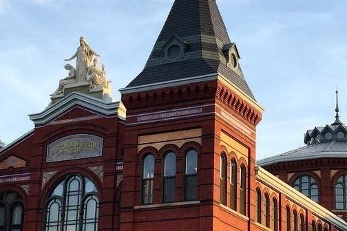 a large brick building with a clock tower