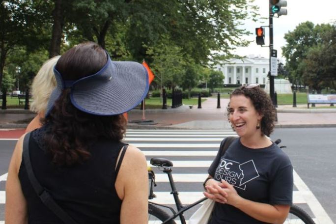 a couple of people that are standing in the street