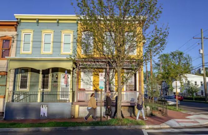 Strolling past row houses on a walking tour of Anacostia with guide Christine Historic Anacostia Architecture Tour